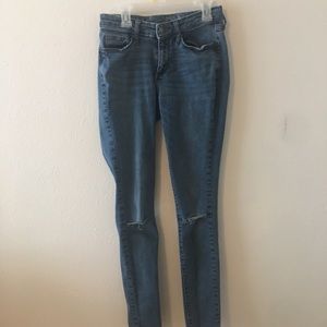 Distressed blue jeans